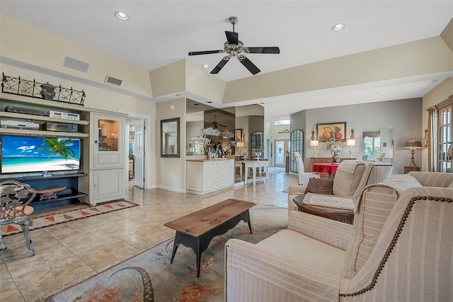 living room featuring baseboards, light tile patterned floors, visible vents, and recessed lighting