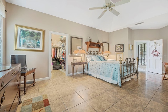 bedroom with light tile patterned floors, baseboards, visible vents, a spacious closet, and a closet