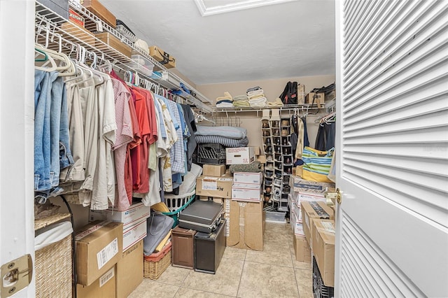 spacious closet featuring light tile patterned floors