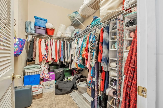 spacious closet with tile patterned flooring