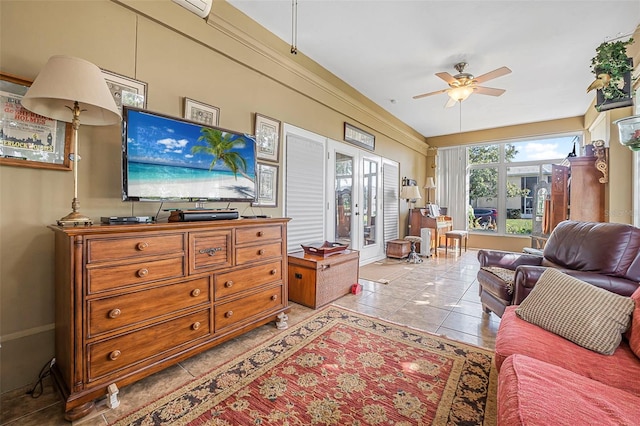 living room featuring ceiling fan, french doors, light tile patterned floors, and baseboards