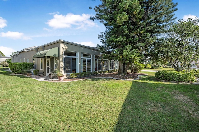 view of yard with a sunroom