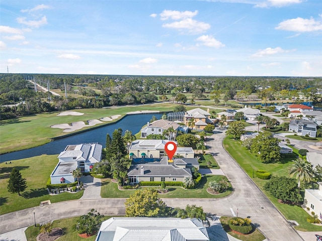 drone / aerial view featuring a residential view and a water view