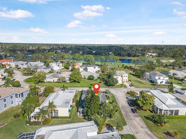 drone / aerial view with a residential view and a water view