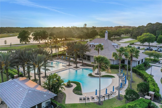 community pool featuring a patio and fence