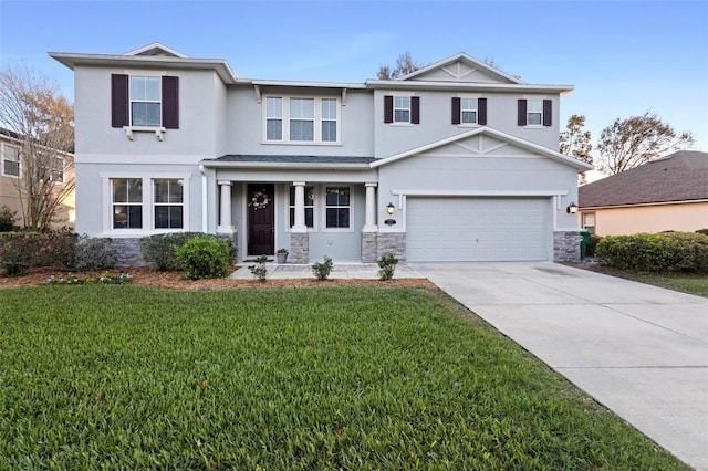 view of front facade featuring a front lawn and a garage