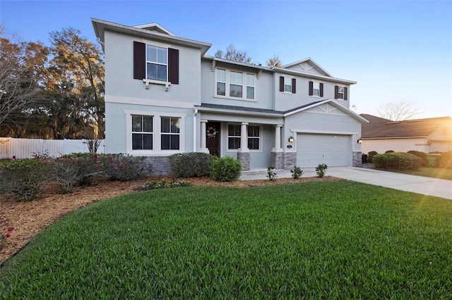 view of front of home with a front lawn and a garage