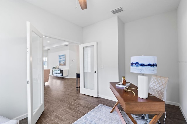 office space featuring ceiling fan, french doors, and dark hardwood / wood-style flooring