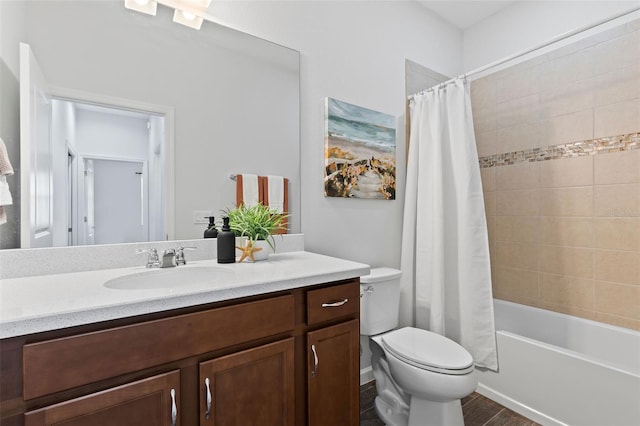 full bathroom featuring toilet, vanity, and shower / bath combination with curtain