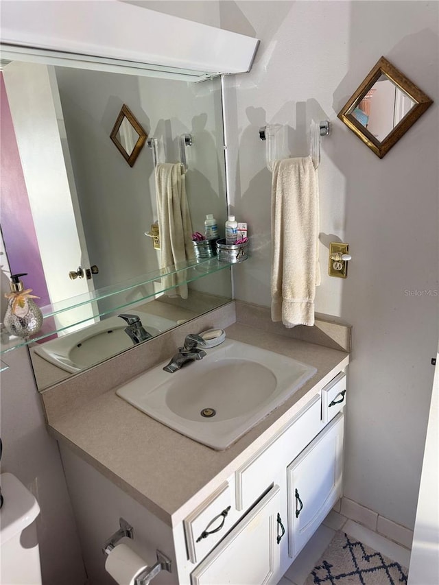 bathroom with tile patterned flooring and vanity