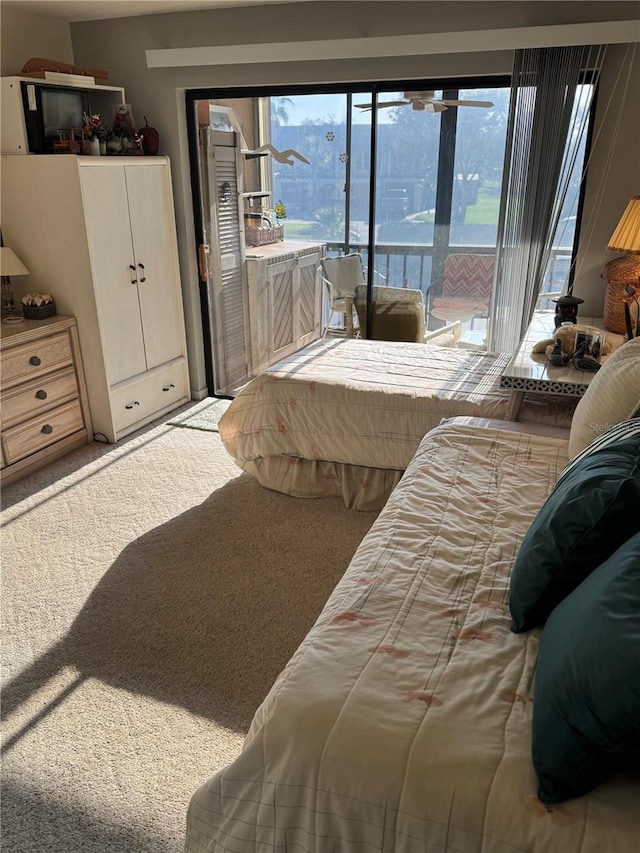 carpeted bedroom with access to outside