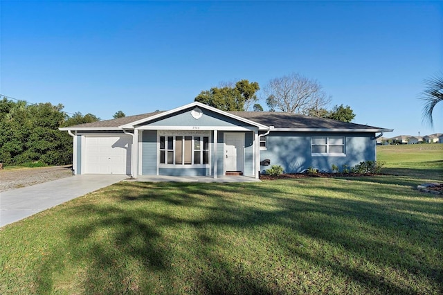 single story home with a garage, concrete driveway, and a front lawn