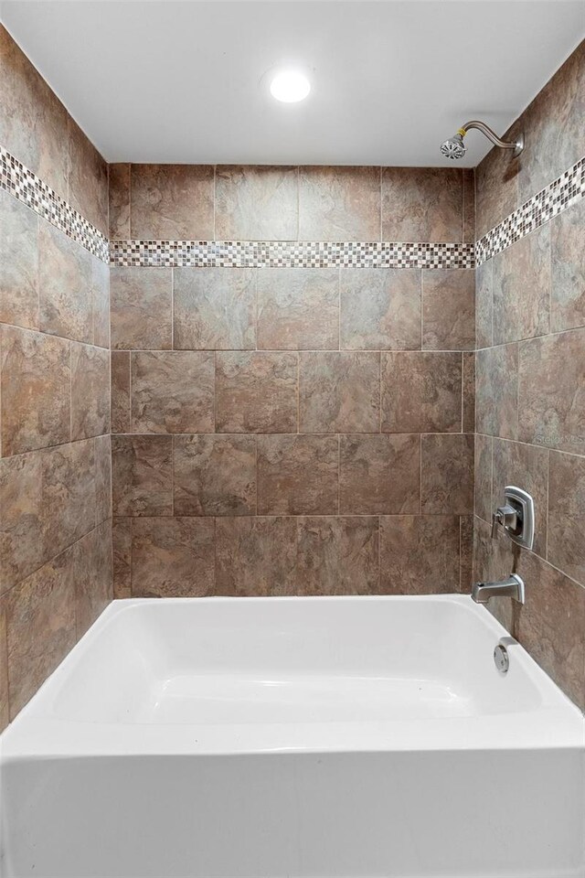 bathroom with tub / shower combination