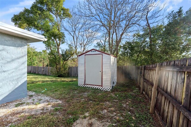 view of shed featuring a fenced backyard