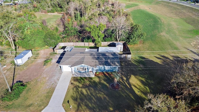 birds eye view of property with a rural view