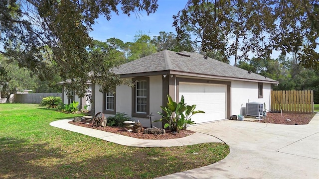 view of home's exterior featuring cooling unit, a garage, and a lawn