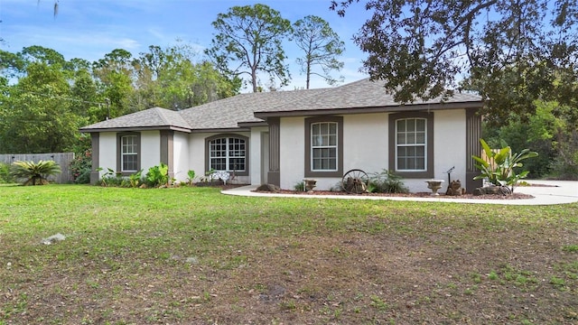 single story home featuring a front yard