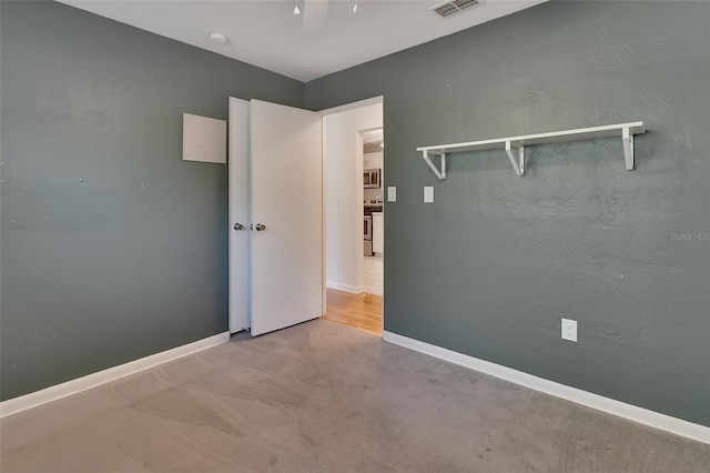 empty room featuring visible vents and baseboards