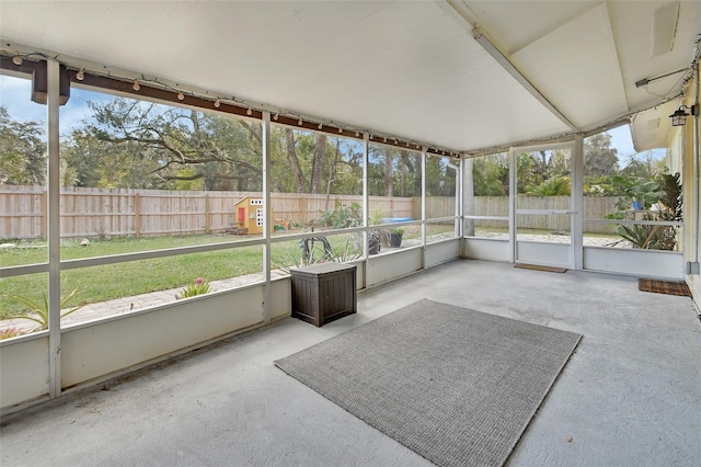 unfurnished sunroom featuring plenty of natural light