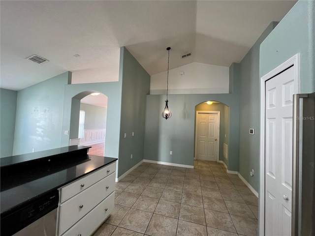 kitchen featuring white cabinetry, visible vents, arched walkways, and stainless steel dishwasher