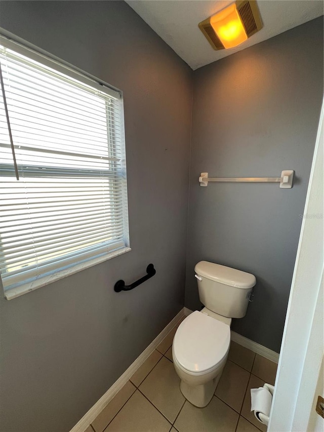 bathroom featuring visible vents, tile patterned flooring, toilet, and baseboards