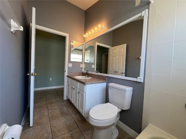 bathroom with toilet, tile patterned flooring, baseboards, and vanity