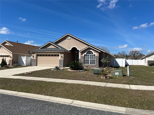 ranch-style house featuring driveway, an attached garage, fence, and stucco siding