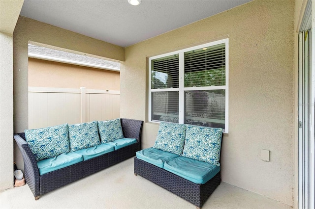 view of patio / terrace with fence and an outdoor living space