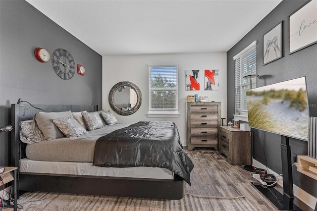 bedroom featuring wood finished floors