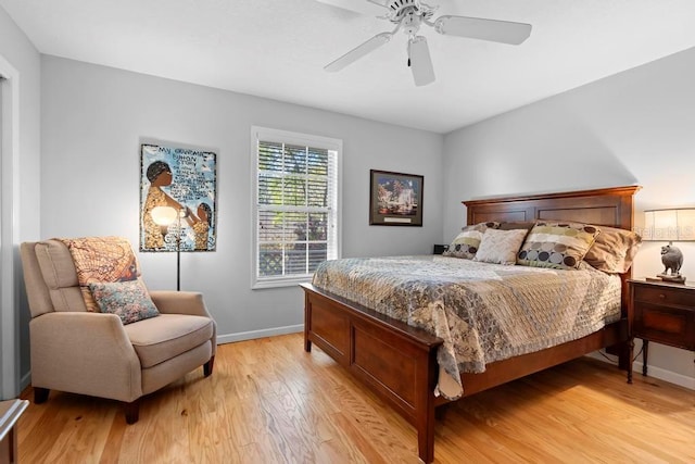 bedroom featuring light wood-type flooring, ceiling fan, and baseboards