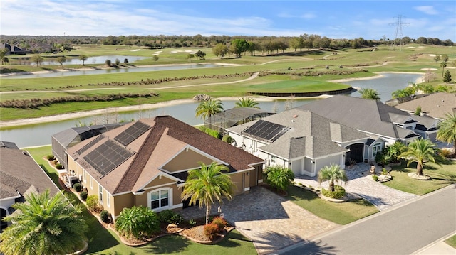 aerial view with view of golf course and a water view