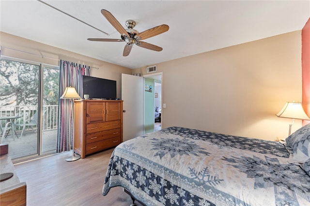 bedroom with light wood-style floors, access to outside, visible vents, and a ceiling fan