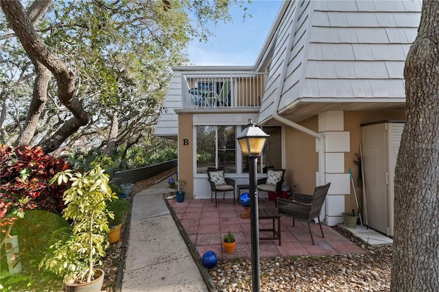 view of patio with a balcony