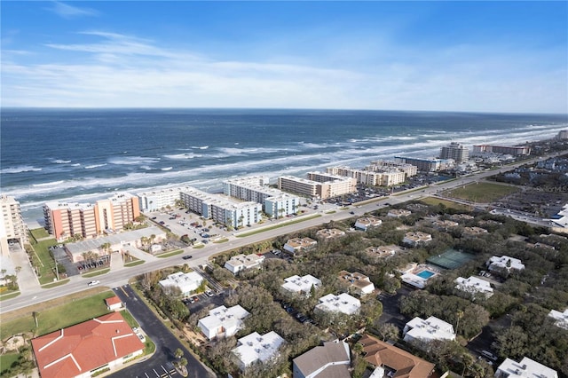 birds eye view of property with a water view and a city view