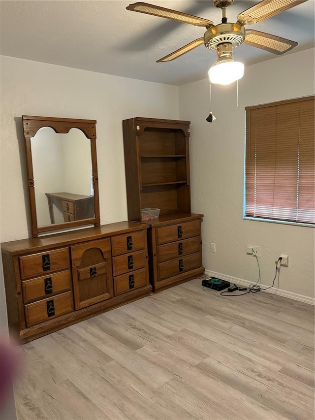 bedroom with ceiling fan and light hardwood / wood-style flooring