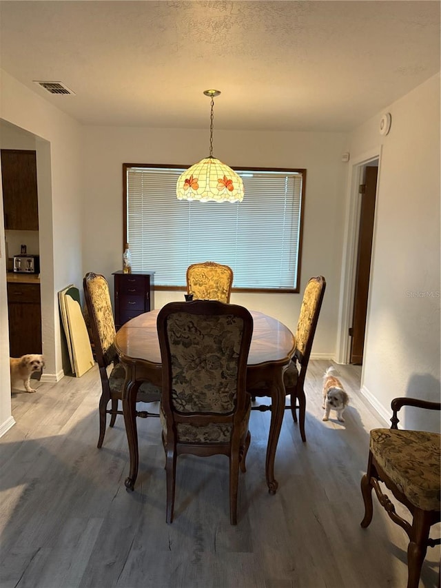 dining room with hardwood / wood-style floors