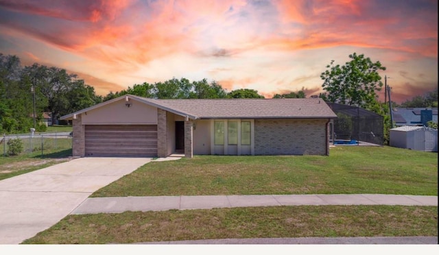 1420 Felton St, Deltona, FL 32725 - ranch-style house featuring a garage, concrete driveway, and brick siding