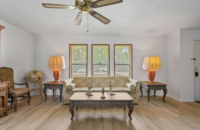1420 Felton St, Deltona, FL 32725 - living area featuring baseboards, ceiling fan, and light wood finished floors