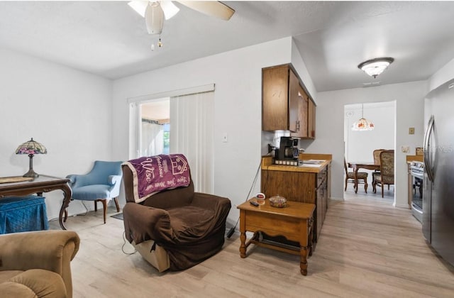 1420 Felton St, Deltona, FL 32725 - living area with light wood-style floors, ceiling fan, and baseboards
