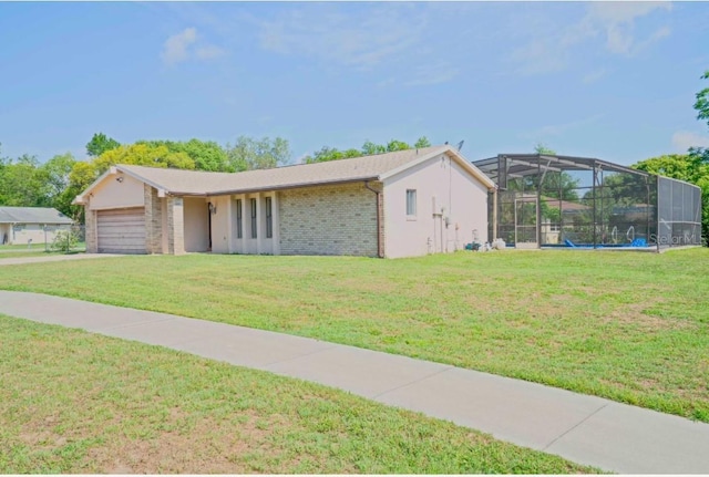 1420 Felton St, Deltona, FL 32725 - view of front of property with a front lawn, brick siding, glass enclosure, and a garage