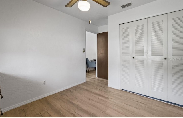 1420 Felton St, Deltona, FL 32725 - unfurnished bedroom featuring wood finished floors, a closet, baseboards, and ceiling fan