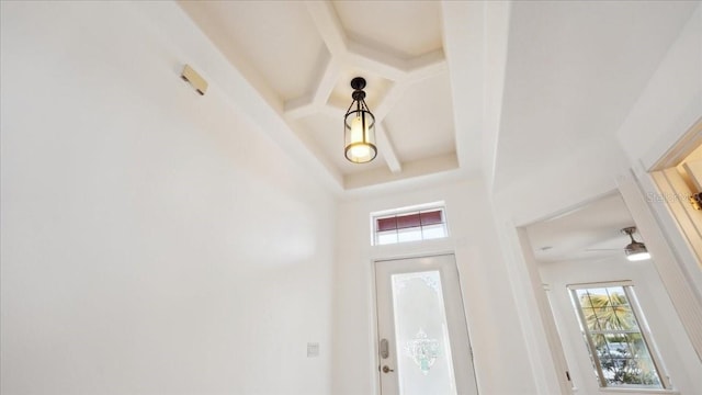 foyer with beam ceiling and coffered ceiling