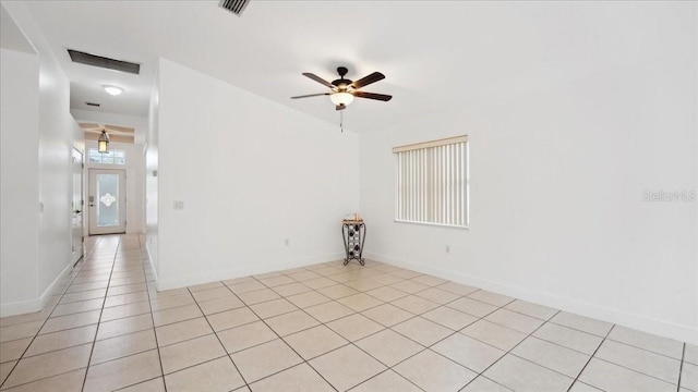 empty room featuring light tile patterned floors and ceiling fan