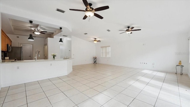 spare room featuring light tile patterned floors and sink