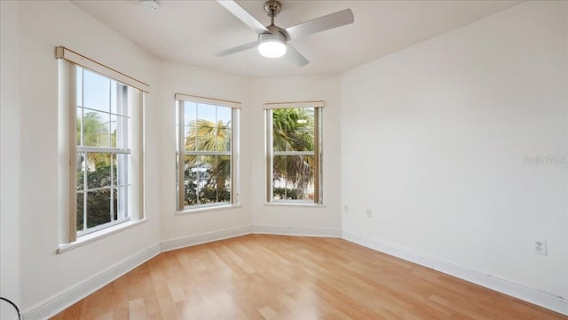 unfurnished room with ceiling fan and light hardwood / wood-style floors