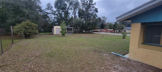 view of yard with an outbuilding and a storage unit