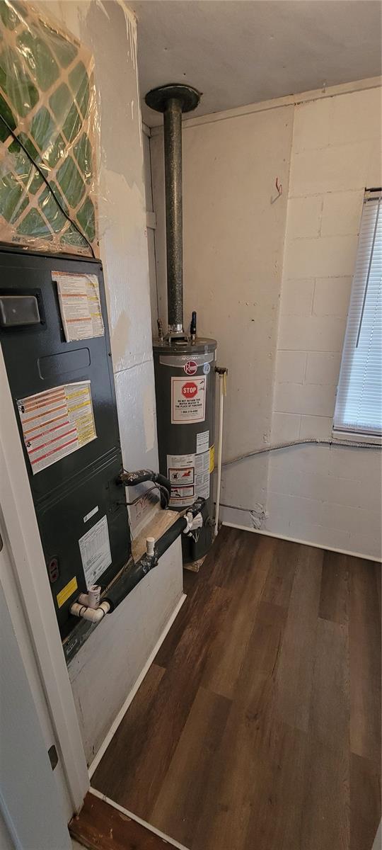 utility room with water heater