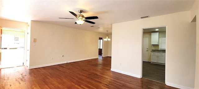 unfurnished living room featuring dark wood-style floors, visible vents, ceiling fan, and baseboards