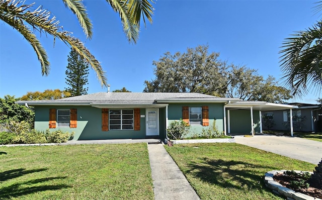 view of front of house featuring a carport, concrete driveway, a front lawn, and stucco siding