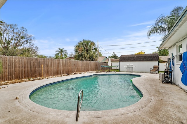 445 Virginia Ave, Saint Cloud, FL 34769 - view of pool featuring a fenced backyard, a patio area, and an outbuilding